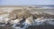 Panoramic view of the Kazakh steppe with ditches from the water and chalk slopes
