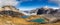 Panoramic view of Laghi del piani lakes and huge rocky mountains in Tre Cime di Lavaredo park