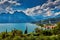 Panoramic view on Lake Garda from the Busatte-Tempesta trail near Nago-Torbole with the iron staircase,  Torbole  town surrounded