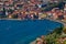 Panoramic view on Lake Garda from the Busatte-Tempesta trail near Nago-Torbole with the iron staircase,  Torbole  town surrounded