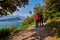 Panoramic view on Lake Garda from the Busatte-Tempesta trail near Nago-Torbole with the iron staircase,  Torbole  town surrounded