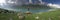 Panoramic view of lake. Hiker enjoying view of dramatic landscape