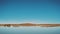 Panoramic view of The Lake of Merzouga Morocco, bird fly over the lake, birds on the lake and wild camels walk on