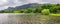 Panoramic view of lake and mountains in Hoomaluhia botanical garden, Oahu island