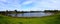 Panoramic view of a lake a park in broadmeadows Melbourne Victoria surrounded by lush green trees