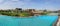 Panoramic view on landmark of Tashkent city park and lake. Blue sky reflected in azure water