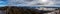Panoramic view of landscape and paragliding over Nahuel Huapi lake and mountains, with snowed peaks in the background. Concept of