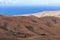 Panoramic view at landscape from viewpoint Mirador Morro Velosa on Fuerteventura with  multi colored volcanic mountainss and the