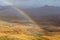 Panoramic view at landscape from viewpoint Mirador Morro Velosa on Fuerteventura, Spain with rainbow and multi colored volcanic