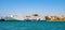 Panoramic view of large ferry ship docked in Piraeus port at the Saronic Gulf of Aegean sea in broad metropolitan Athens area in
