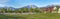 Panoramic view of a large field at the front of residential houses at Daybreak, Utah