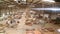 Panoramic view of a large furniture factory. People work in a furniture factory. Large furniture manufacturing plant