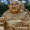 Panoramic view on the large golden praying sitting buddha. Korean Haedong Yonggungsa Temple. Busan, South Korea, Asian