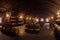 panoramic view of a large wine cellar with rows of barrels