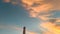 panoramic view of the lighthouse and sky at dusk orange sky sun blue