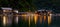 Panoramic view of lights from cafe and inn reflecting off water at Ine, Kyoto