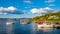 Panoramic view of Lindoya island on Oslofjord harbor near Oslo, Norway, with Lindoya Vest marina and summer cabin houses at