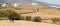 Panoramic view of a local village at Paros island in Greece with a horse eating hay.