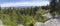 Panoramic view from look out in Brdy mountain hills, with green trees, rocks town and blue sky, Czech Republic