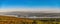 Panoramic view of lough Leane with Ross Island and castle on a sunny foggy summer morning