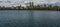 Panoramic view of luxury buildings overlooking the Jacqueline Onassis Reservoir in Central Park