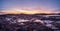 Panoramic view of magenta winter dawn. The icy landscape and mountains in the Russian village Teriberka