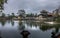 Panoramic view of the majestic Imperial City in Hue, Vietnam, with a body of water and lush greenery