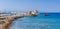 Panoramic view of Mandraki harbor and marina in the place of the Colossus of Rhodes. Mooring yachts and vessels.  Ancient