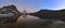 Panoramic view of the Matterhorn peak reflected in the Riffelsee.