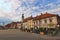 Panoramic view medieval buildings against vibrant autumn sky. The Rotovz Town Hall Square in Maribor.