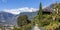 Panoramic view of Merano in Italy with mountains in background.