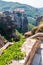 Panoramic view from Meteoron Monastery cliff stone stairs on scenic Meteora landscape rock formations with Monastery of Varlaam on