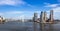Panoramic view from the Meuse river on the Erasmus bridge and modern highrise on Kop van Zuid. Rotterdam, Zuid-Holland, The