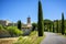 Panoramic view of the the minuscule old hilltop village of Maubec-Vieux, with beautiful stone houses with blue shutters lining the