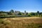 Panoramic view of the the minuscule old hilltop village of Maubec-Vieux, with beautiful stone houses with blue shutters lining the