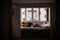 Panoramic view of a modern apartment with a window near which a couple in love hugs on the bed