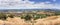 Panoramic view of Morgan Hill, a mainly residential and agricultural town in Santa Clara County, California; dry grass growing