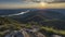 Panoramic view from a mountain peak reveals a vast landscape