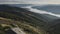 Panoramic view from a mountain peak reveals a vast landscape