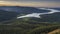 Panoramic view from a mountain peak reveals a vast landscape