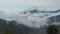 Panoramic view of a mountain surrounded by clouds with cloudy sky. Ecuador landscape