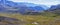 Panoramic view of a mountain valley. Tundra, treeless mountain slopes