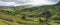 Panoramic view of mountains and meadows