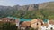Panoramic view of the mountains, the reservoir and the roofs of the houses