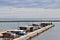 Panoramic view of the mouth of the Pescara river with the pier full of Trebuchet, ancients fishing machine.