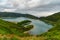 Panoramic view of natural landscape in the Azores, wonderful island of Portugal. Beautiful lagoons in volcanic craters and green f