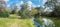 Panoramic view of nature reserve at the riverbank of Werribee River. Beautiful Australian nature landscape with native trees