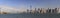Panoramic view of New York City skyscrapers of Lower Manhattan and Ellis Island viewed from the water