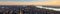 Panoramic view of New York City at Sunset . Brooklyn left, Midtown and Lower Manhattan center with Jersey City right