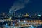 Panoramic view of night Moscow. Big city lights. Steam comes from the CHP pipes
